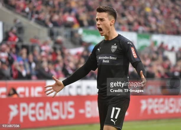 Erik Thommy of Stuttgart celebrates after Andreas Beck of Stuttgart scored their team`s third goal during the Bundesliga match between 1. FC Koeln...