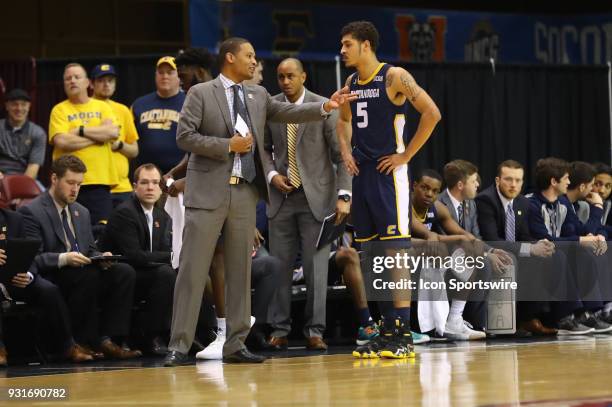Chattanooga Mocs head coach Lamont Paris speaks with Chattanooga Mocs guard Nat Dixon during the college basketball game between UT-Chattanooga and...