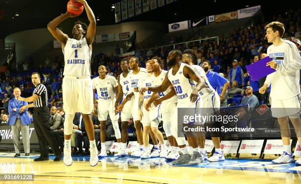 Middle Tennessee Blue Raiders bench watches as Middle Tennessee Blue Raiders forward Brandon Walters puts up a three point basket during the fourth...