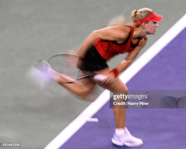 Angelique Kerber of Germany serves in her match against Caroline Garcia of France during the BNP Paribas Open at the Indian Wells Tennis Garden on...