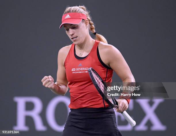 Angelique Kerber of Germany celebrates a point in her match against Caroline Garcia of France during the BNP Paribas Open at the Indian Wells Tennis...