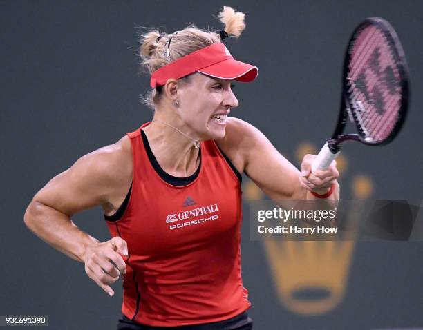 Angelique Kerber of Germany reacts to her forehand in her match against Caroline Garcia of France during the BNP Paribas Open at the Indian Wells...