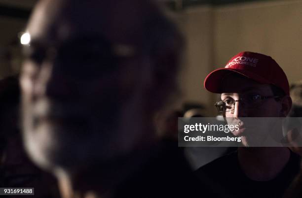 Attendees watch polling results during an election night rally with Rick Saccone, Republican candidate for the U.S. House of Representatives, not...