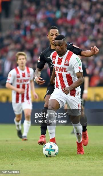 Dennis Aogo of Stuttgart and Jhon Cordoba of Koeln battle for the ball during the Bundesliga match between 1. FC Koeln and VfB Stuttgart at...