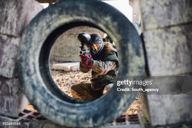 waiting for her enemy - paintball stock pictures, royalty-free photos & images