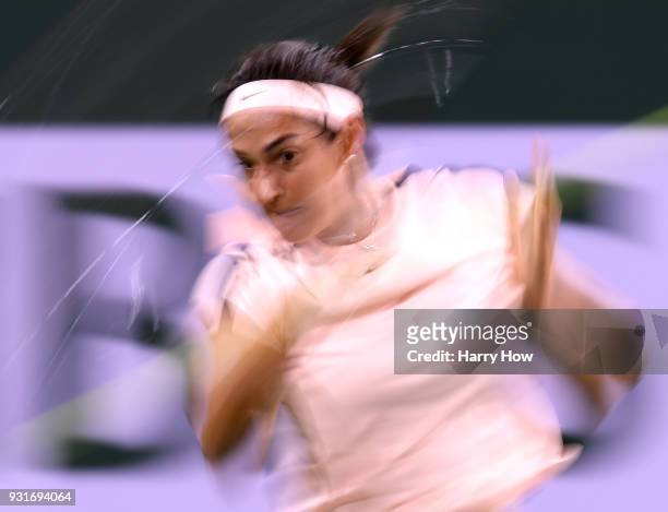 Caroline Garcia of France hits a forehand in her match against Angelique Kerber of Germany during the BNP Paribas Open at the Indian Wells Tennis...