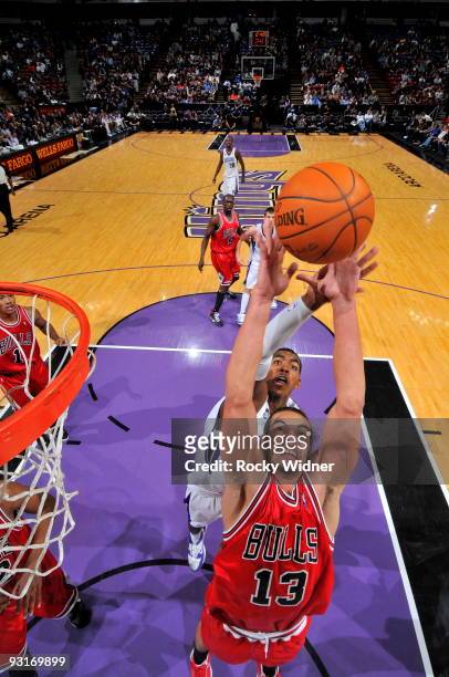 Joakim Noah of the Chicago Bulls grabs the rebound against Jason Thompson of the Sacramento Kings on November 17, 2009 at ARCO Arena in Sacramento,...