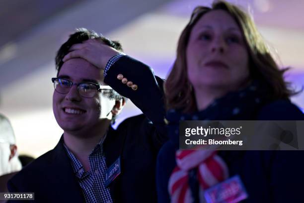 Attendees wait during an election night rally with Conor Lamb, Democratic candidate for the U.S. House of Representatives, not pictured, in...