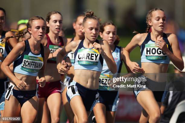Sarah Schiffmann, Lauren Carey and Nicola Hogg of NSW compete in the Women's 3000 Metre Run Under 16 during day one of the Australian Junior...