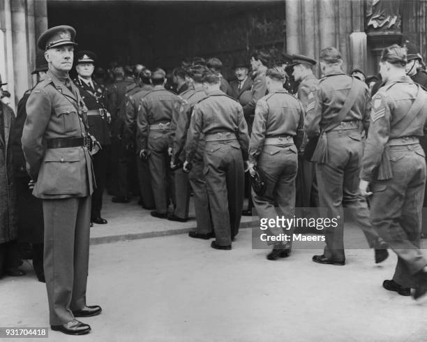 Lieutenant Colonel James Carne, VC watches his men, the 1st Battalion of the Gloucester Regiment, enter Gloucester Cathedral for a Thanksgiving...