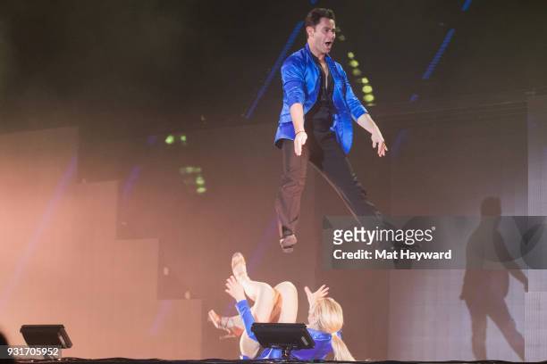 Dancers Emma Slater and Sasha Farber perform on stage during Dancing With The Stars Live! at WaMu Theater on March 13, 2018 in Seattle, Washington.