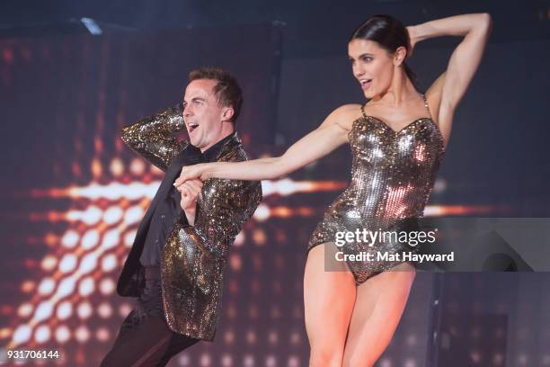 Hayley Erbert and Frankie Muniz perform on stage during Dancing With The Stars Live! at WaMu Theater on March 13, 2018 in Seattle, Washington.