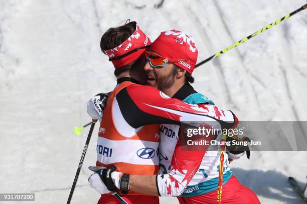 Brian McKeever of Canada celebrates with his guide Russell Kennedy after winning the Cross-Country Skiing 5km Sprint Classic Final, Visually Impaired...