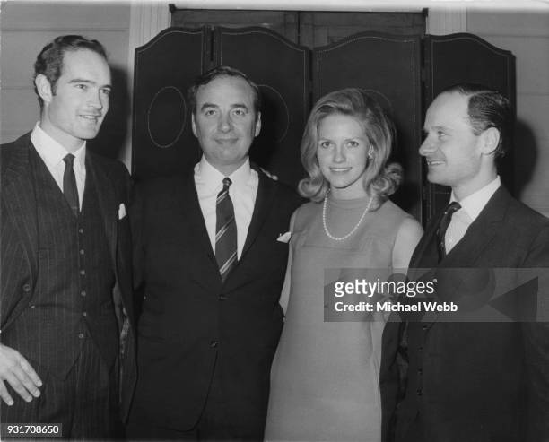 From left to right, Clive Carr , Rupert Murdoch and his wife Anna, and William Carr , during a meeting of 'News of the World' shareholders in London,...