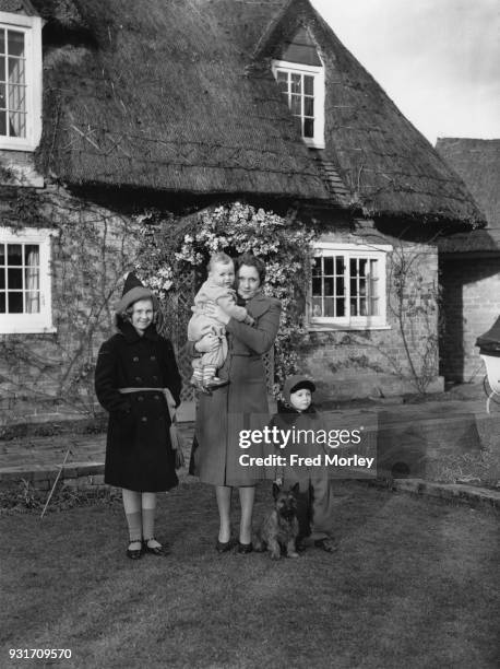 English author Barbara Cartland , the wife of Hugh McCorquodale, moves into River Cottage in Great Barford, Bedfordshire with her daughter Raine and...