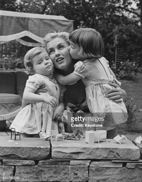Mexican actress Linda Christian visits her two daughters Romina and Taryn in Ripley, Surrey, during a break from filming on the Continent, 28th June...