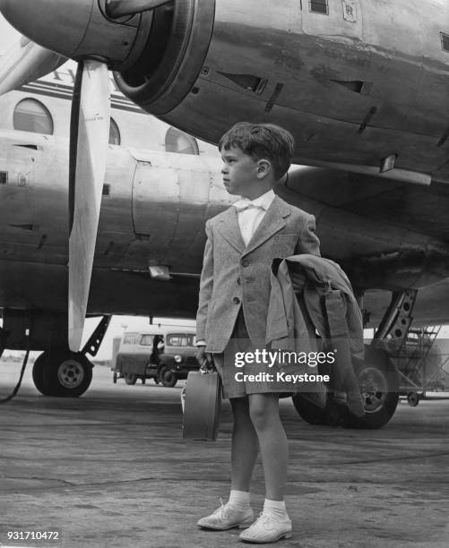 Eugene Chaplin, the son of filmmaker Charlie Chaplin and Oona O'Neill arrives at London Airport with three other family members for a holiday in...