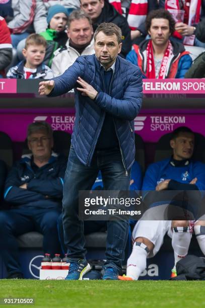 Head coach Bernd Hollerbach of Hamburg gestures during the Bundesliga match between FC Bayern Muenchen and Hamburger SV at Allianz Arena on March 10,...