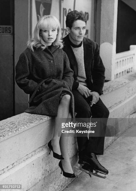 English actress Jill Haworth and French actor Jacques Charrier film a scene for Michel Deville's 'À cause, à cause d'une femme' at the Molitor ice...