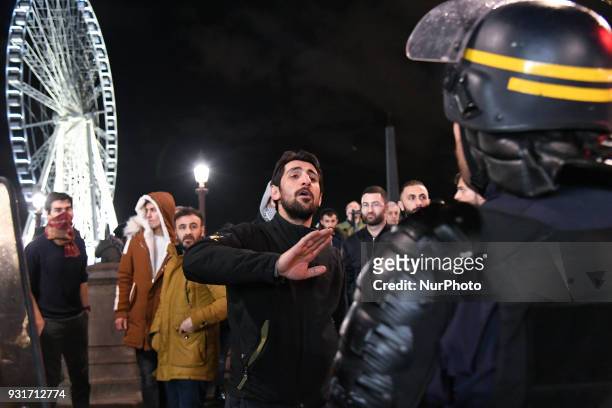 Kurds protesters face off with riot police during a protest in support of Syria's Afrin near the US Embassy on Place de la Concorde in Paris on March...