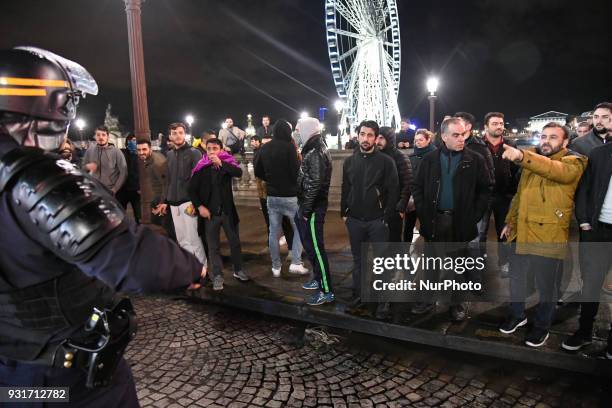 Kurds protesters face off with riot police during a protest in support of Syria's Afrin near the US Embassy on Place de la Concorde in Paris on March...