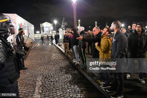 Kurds protesters face off with riot police during a protest in support of Syria's Afrin near the US Embassy on Place de la Concorde in Paris on March...