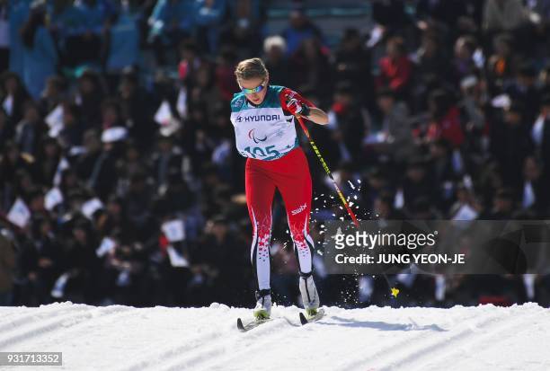 Emily Young of Canada competes in the women's 1.5km sprint classic standing cross-country skiing event of the Pyeongchang Winter Paralympic Games at...