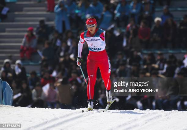 Yurika Abe of Japan competes in the women's 1.5km sprint classic standing cross-country skiing event of the Pyeongchang Winter Paralympic Games at...