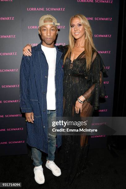 Pharrell Williams and Ofira Sandberg attend Lorraine Schwartz launches The Eye Bangle a new addition to her signature Against Evil Eye Collection at...