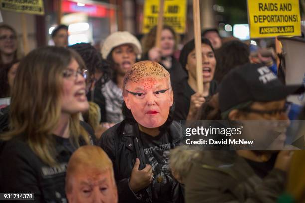 Anti-Trump protesters rally outside the InterContinental Los Angeles Downtown hotel where U.S. President Donald Trump is spending the night during...