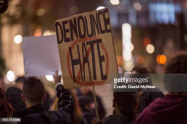 Anti-Trump protesters rally outside the InterContinental Los Angeles Downtown hotel where U.S. President Donald Trump is spending the night during...