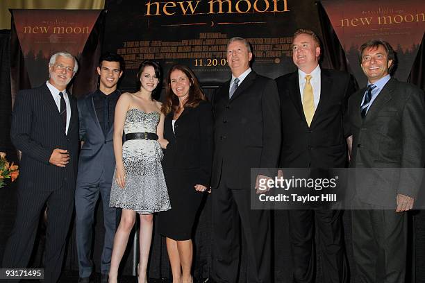 Rob Friedman, Taylor Lautner, Kristen Stewart, Amy Miles, Mike Campbell, Greg Dunn and Patrick Waschberger attend the New Moon's Regal Benefit...