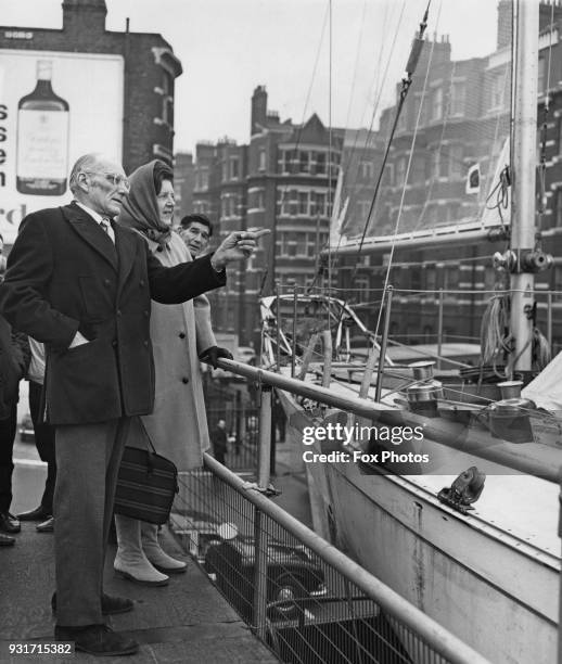 Yachtsman Sir Francis Chichester and Lady Chichester look at the ketch 'Gipsy Moth IV' at a preview of the 1968 Boat Show at Earl's Court, London,...