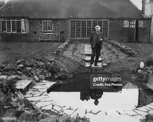 English writer G. K. Chesterton at his home in Beaconsfield, UK, February 1926.