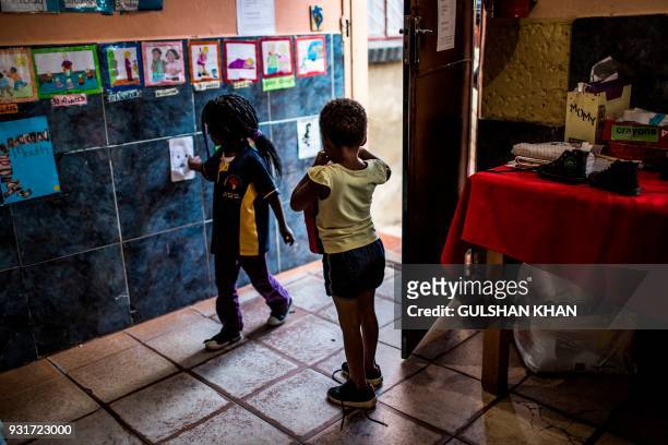 Children play in class at the Childrens Orientation Centre in Klipspruit West, in Soweto, on March 13, 2017. - Nine children under the age of five...