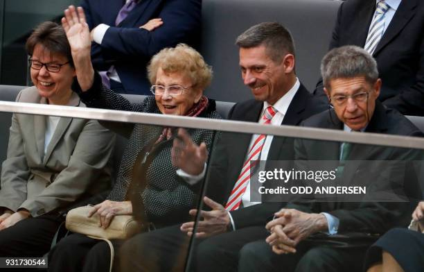 Herlind Kasner, , the mother of German Chancellor Angela Merkel waves, as Joachim Sauer , the Chancellor's husband, and his son Daniel Sauer , and...