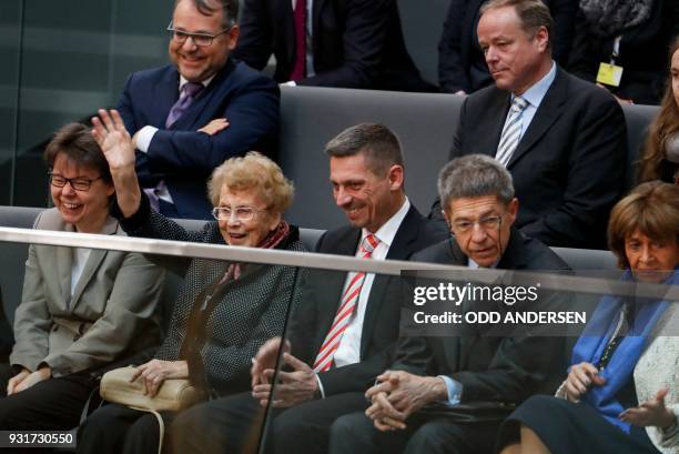 Herlind Kasner, , the mother of German Chancellor Angela Merkel waves, as Joachim Sauer , the Chancellor's husband, and his son Daniel Sauer , her...