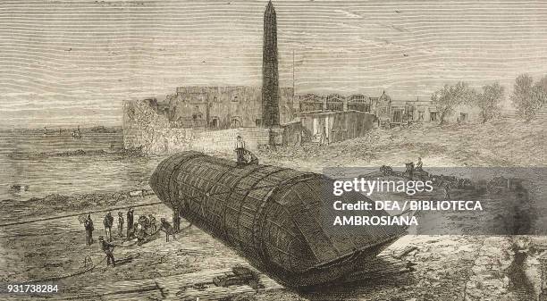 Cleopatra's Needle, rolling the obelisk down the beach near the Caesareum of Alexandria Egypt, engraving, illustration from the magazine The Graphic,...