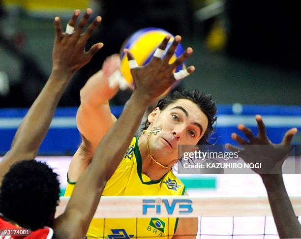 Brazil's captain Gilberto Godoy Filho "Giba" attacks against Cuba during the men's grand championship cup volleyball in Osaka on November 18, 2009....