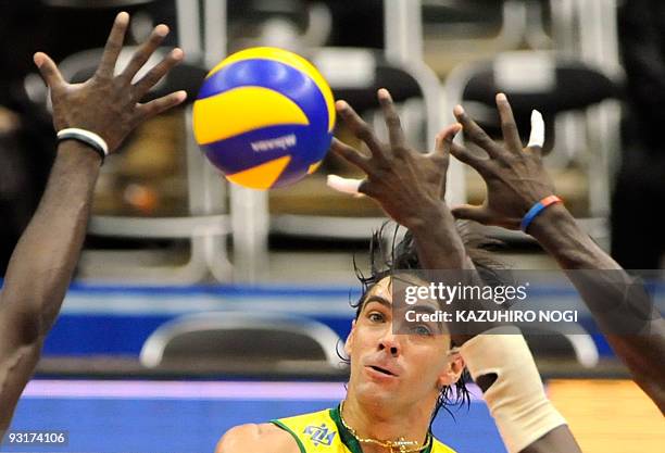 Brazil's captain Gilberto Godoy Filho "Giba" attacks against Cuba during the men's grand championship cup volleyball in Osaka on November 18, 2009....