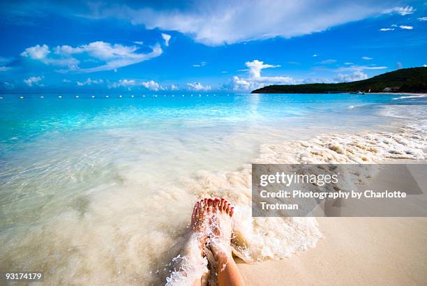 feet with waves coming over them in the carribean - antigua leeward islands bildbanksfoton och bilder