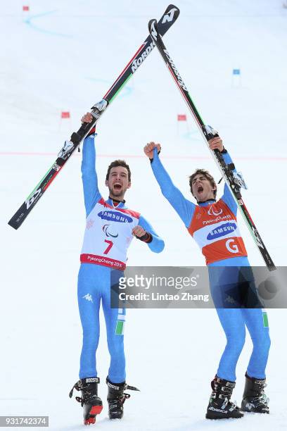 Gold Medalist Giacomo Bertagnolli and his guide Fabrizio Casal of Italy celebrates at the victory ceremony for Men's Giant Slalom Visually Impaired...