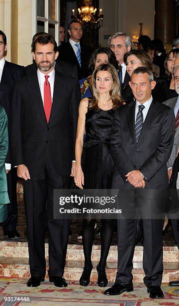 Prince Felipe of Spain and Princess Letizia of Spain pose with guests ahead of the Francisco Cerecedo Journalism Award ceremony at The Ritz Hotel on...