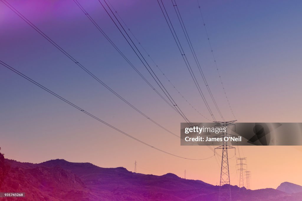 Electricity pylons at sunset