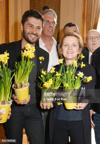 Presenter Christophe Beaugrand and Mayor of Paris 5th district Florence Berthout attend Une Jonquille pour Institut Marie Curie Place du Pantheon on...