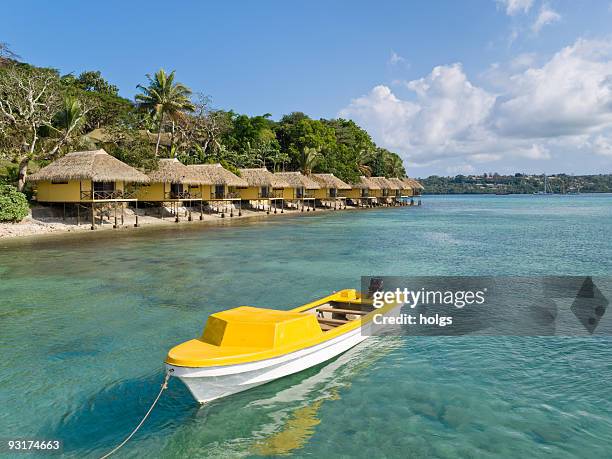 yellow boat in front of iririki, vanuatu - port vila stock pictures, royalty-free photos & images