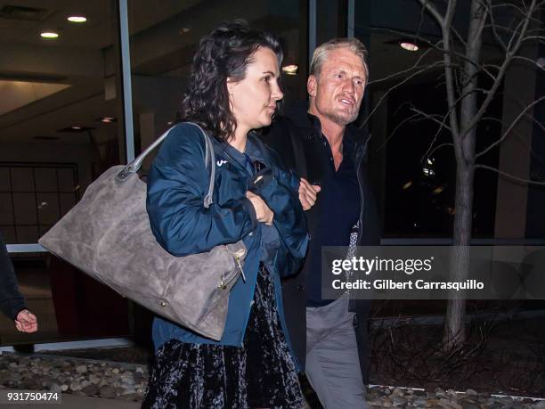 Actor Dolph Lundgren and Jenny Sandersson are seen arriving to Philadelphia International Airport on March 13, 2018 in Philadelphia, Pennsylvania.