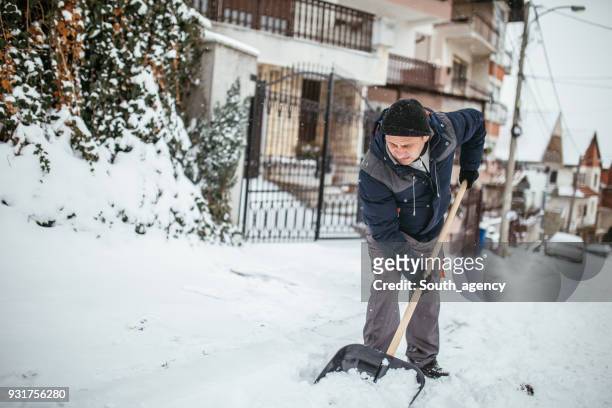 guy doing winter chores - shoveling driveway stock pictures, royalty-free photos & images