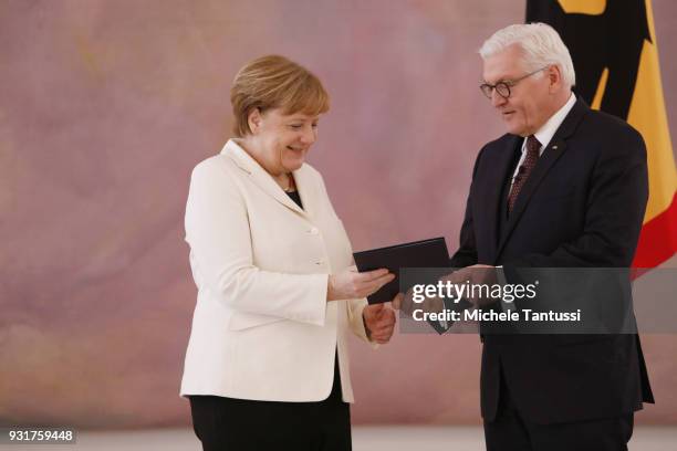 German Chancellor Angela Merkel takes her oath to serve her fourth term as chancellor with German President Frank-Walter Steinmeier, following her...