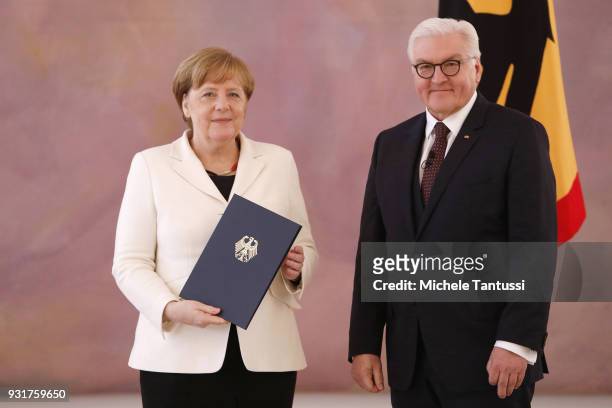 German Chancellor Angela Merkel takes her oath to serve her fourth term as chancellor with German President Frank-Walter Steinmeier, following her...